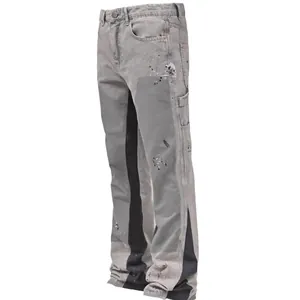 Heren flare carpenter jeans met gelaagde panelen en verfspat details in grijs zwart.