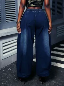 Detailed back view of retro washed blue lantern jeans featuring elastic high waist and pleats.