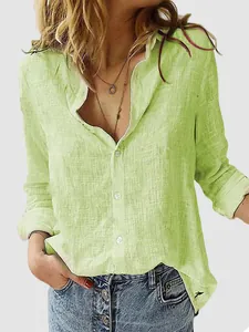 Close-up detail of women's light green linen-texture long-sleeved casual button-down shirt