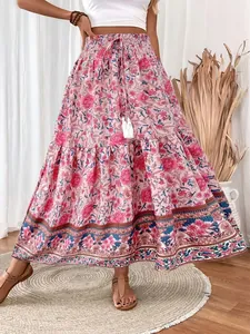 Boho-chic pink floral maxi skirt with tassel drawstring and elastic waist detail