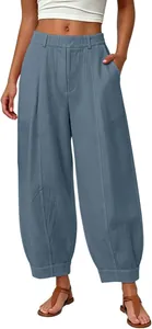 Detailed look at high-waist loose grey-blue harem pants featuring a comfortable linen texture.