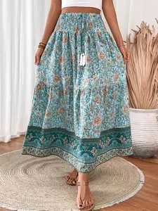 Detailed view of bohemian floral maxi skirt with smocked waist and tassel drawstring.