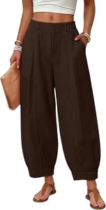 Detailed front view of women's loose high-waisted solid brown harem pants on a model