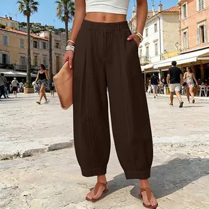 Stylish loose brown harem pants for women in an outdoor casual street setting