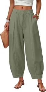 Front view detail of loose olive green high-waisted harem pants for a stylish casual look