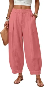 High-waisted loose harem pants in vintage pink, cropped length with pocket details.