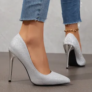 Detailed side view of elegant silver glitter pointed toe high heels with thin stiletto heels