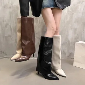 Elegant pointed-toe boots featuring a stylish fold-over design in black, brown, and beige.