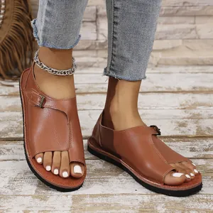 Stylish brown leather flat toe-ring sandals for women with comfortable buckle strap
