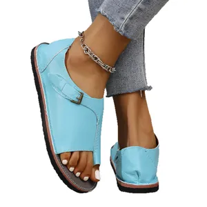 Light blue leather toe-loop beach sandals with adjustable metal buckle and flat sole