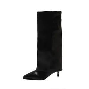 Side view of black pointed toe gaiter boots with stylish fold-over design and kitten heels.