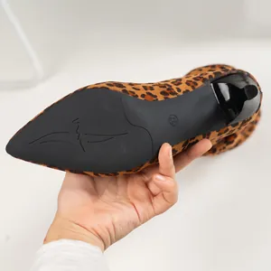 Close-up of leopard print boot sole showing size 37 mark and non-slip texture detail