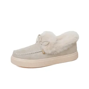 Beige women's winter loafer featuring thick faux fur lining and decorative bow detail
