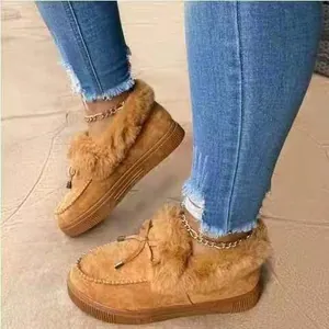 Detailed view of women's winter warm loafers with plush fur trim and thick sole