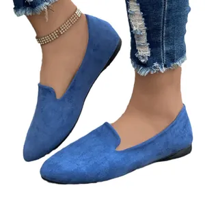 Comfortable women's blue suede flat loafers featuring a pointed toe for casual spring wear
