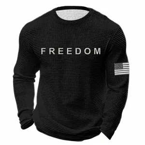 Detail of men's black waffle knit long sleeve sweatshirt with FREEDOM print and flag