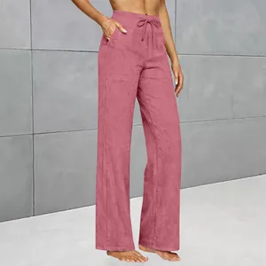 Detailed view of high-waist straight-leg casual pants with drawstring and pockets.