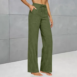 Side view of olive green high waisted wide leg pants with pockets and drawstring