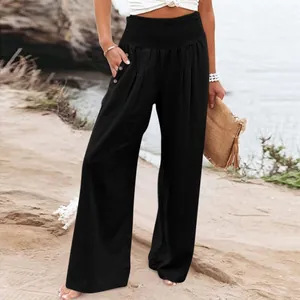 Casual black wide-leg linen pants with high elastic waist and decorative buttons.