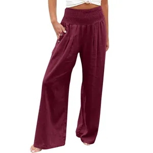 Detail of women's wine red wide-leg linen pants with elastic high waist and pocket buttons