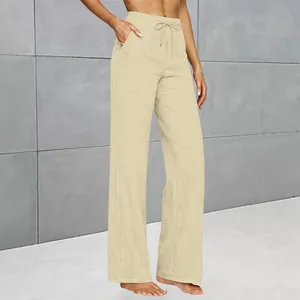 Side view of women's beige wide-leg drawstring pants showing pocket and waist detail