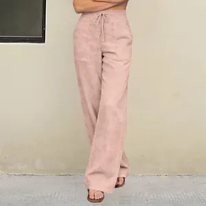 Close-up of high waisted straight leg trousers in dusty rose with functional front pockets