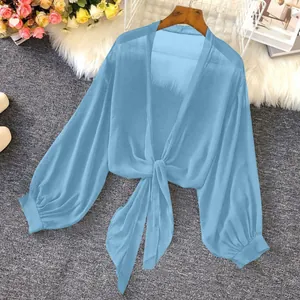 Detailed view of a light blue sheer chiffon sun-protective cardigan with front tie closure