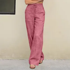 Detail of high-waist straight-leg yoga pants in dusty rose with drawstring waist