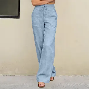 Detail view of light blue high-waisted casual pants with drawstring and pockets