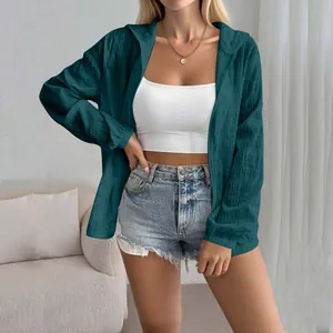 Stylish women's teal sun protection jacket with delicate jacquard texture on a model