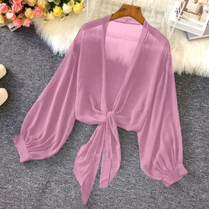 Front view of pink sheer chiffon tie-front blouse showing elegant puff sleeve details