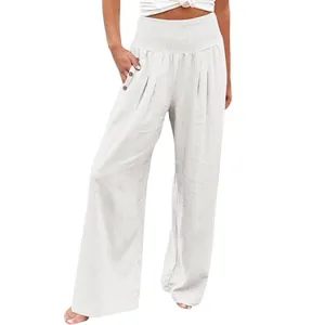 Women's white wide-leg cotton linen trousers featuring a high-waist smocked design