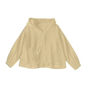 Close-up of the lightweight jacquard fabric on a beige hooded sun-protection jacket