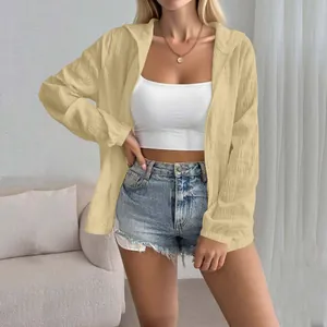 Detailed view of women's long sleeve jacquard sun protection cardigan in yellow