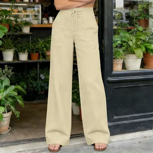 Detail showing the drawstring waist and pocket design of beige wide-leg trousers.