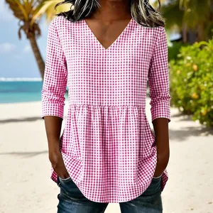 Women's pink gingham checkered top with V-neckline and tiered peplum hem design