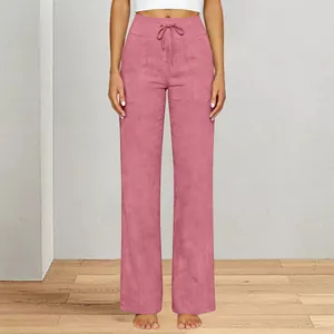 Close-up view of pink wide-leg yoga pants featuring drawstring waist and side pockets