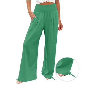 Pantaloni verdi a gamba larga da donna con vita alta elastica e dettaglio nodo.