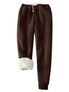 Winterbraune dick mit Fleece gefütterte Damen-Jogginghose mit Kordelzug-Design.