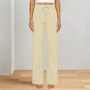 Front view detail of high-waisted khaki wide-leg yoga pants with drawstring waist