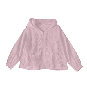 Detailed view of pink jacquard texture on sun protection hooded jacket with zipper