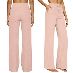 Close-up of pink high-waisted wide-leg trousers featuring drawstring and functional side pockets