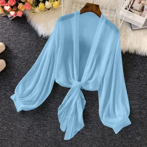 Lightweight blue chiffon sun protection shirt with tie-front and lantern sleeves