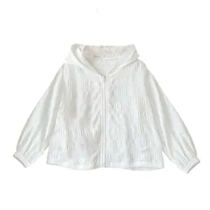 Detailed view of white long-sleeved hooded sun protection jacket with jacquard texture