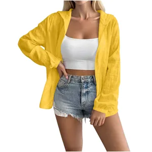 Detail showing the yellow jacquard texture of the long-sleeve sun protection jacket