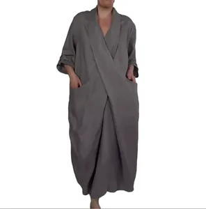 Close-up detail of a grey V-neck long dress for women featuring large side pockets