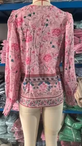 Detailed back view of a pink bohemian floral print blouse with elasticated cuffs