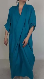 Full-length view of solid teal casual maxi dress with large side pockets and V-neck