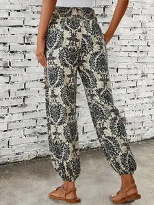 Back view of bohemian ethnic pattern printed harem pants featuring elasticated ankles