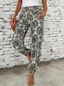 Detail shot of women's bohemian ethnic damask print trousers with elastic waist and pockets